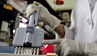 Filipino medical technicians demonstrate dengue diagnostic test